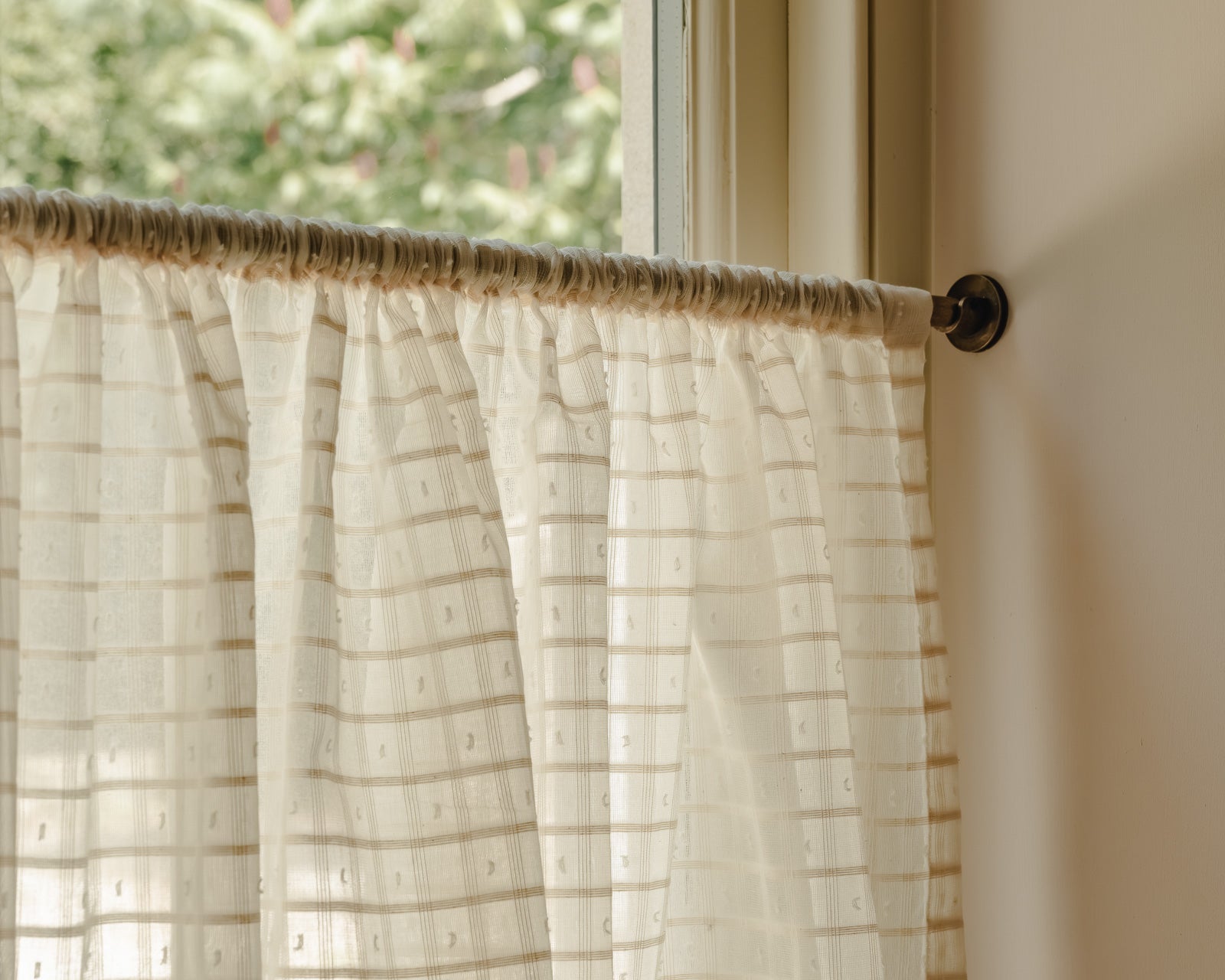 Close-up of Alda cotton in a fine honey check weave with small woven dots, a café curtain fabric at Baywell Studio
