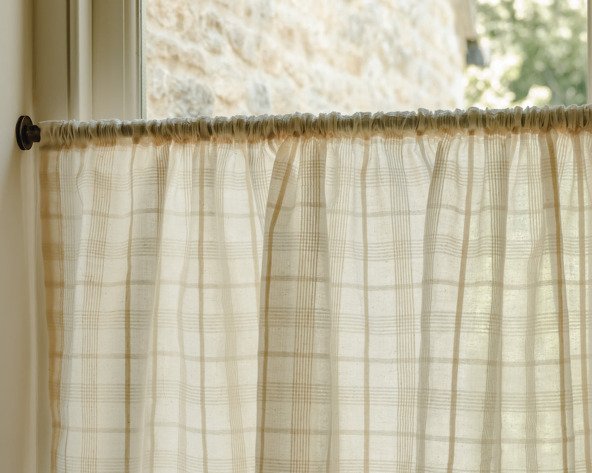 Close-up of Elva cotton in a soft honey windowpane check, a café curtain fabric at Baywell Studio