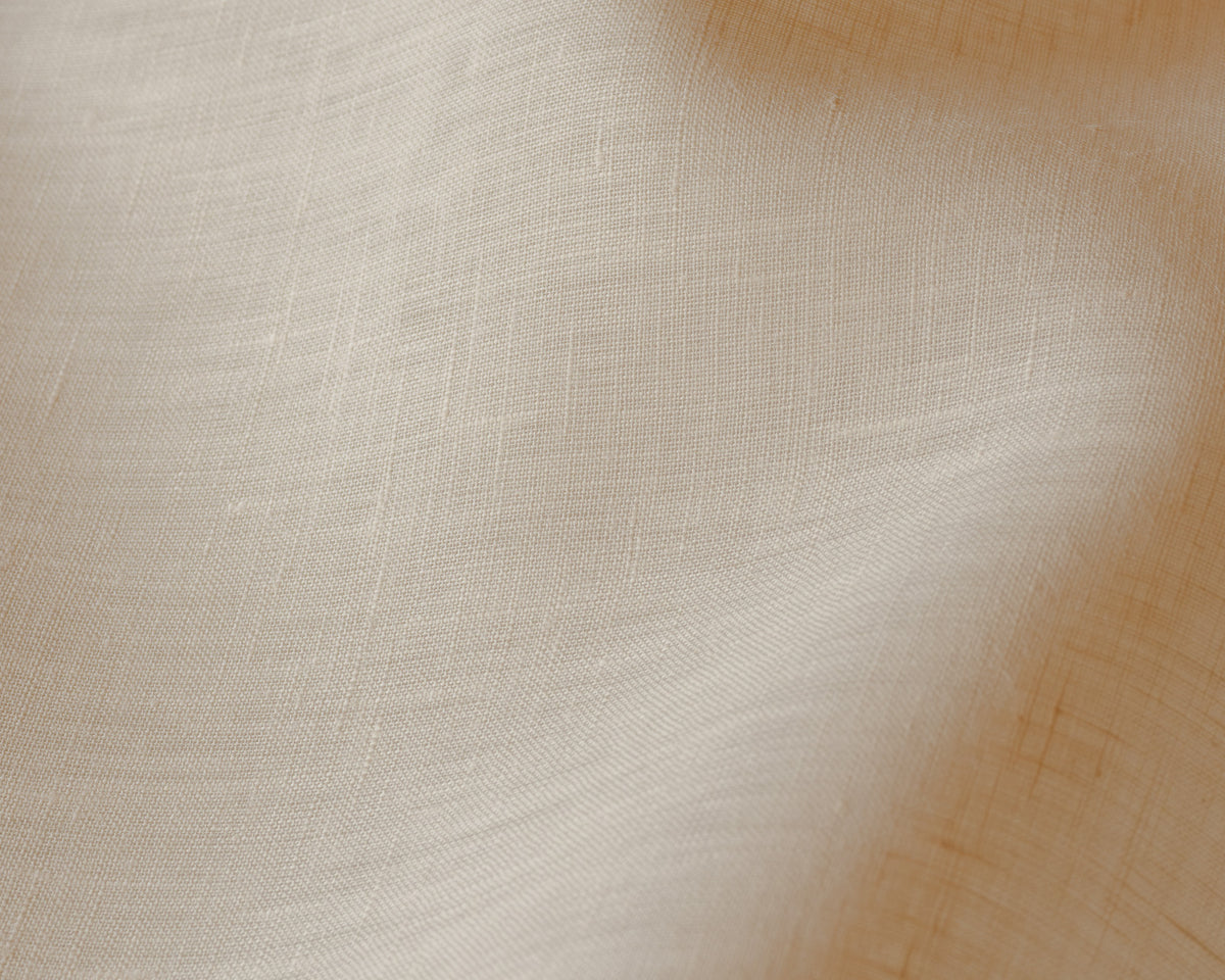 Close-up of Sera linen in cream, showing its soft plain weave and gentle drape, a café curtain fabric at Baywell Studio